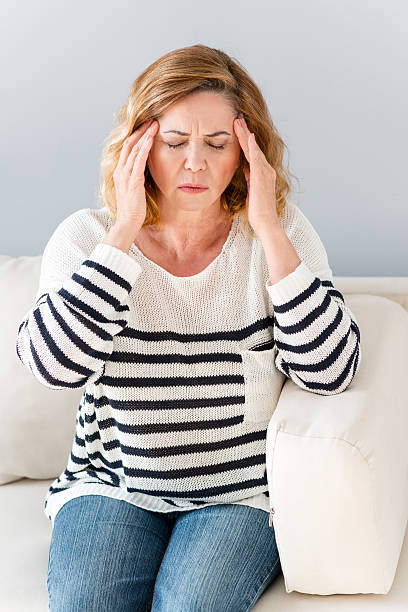 istock Mature lady suffering from headache 564588058