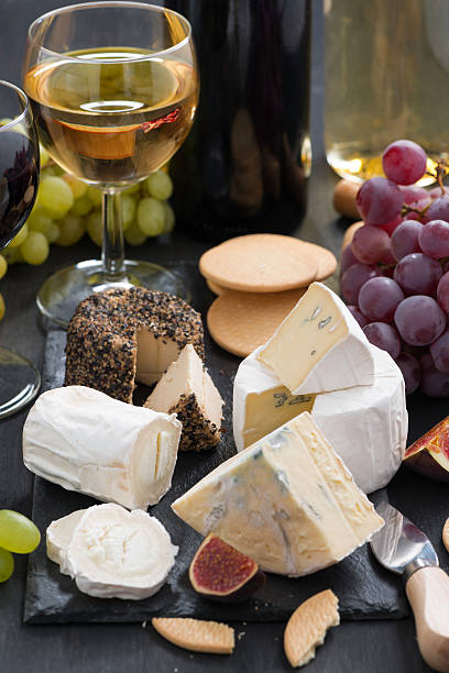 istock delicacy soft cheeses, fruit and crackers - snacks for wine 564588394