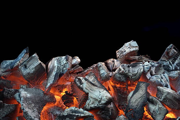 Flaming Charcoal Isolated On Black Background stock photo
