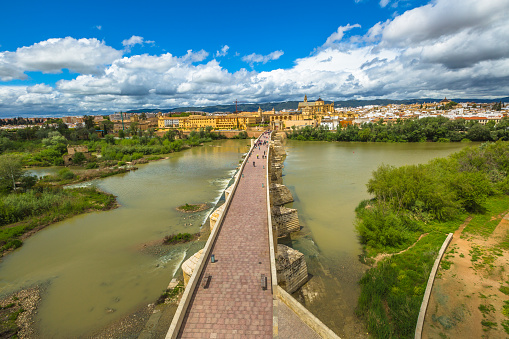 Aerial view to the Roman Bridge on the Guadalquivir river, seen from the Calahorra Tower in Cordoba, Andalusia, Spain.