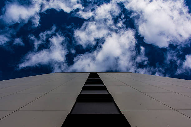 istock View of Tiled Wall Outdoors Deep Blue Sky and Clouds 564590008