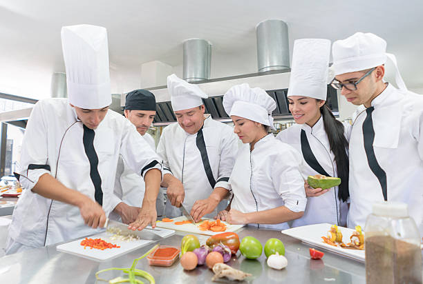 istock Group of people in a cooking class 564594422