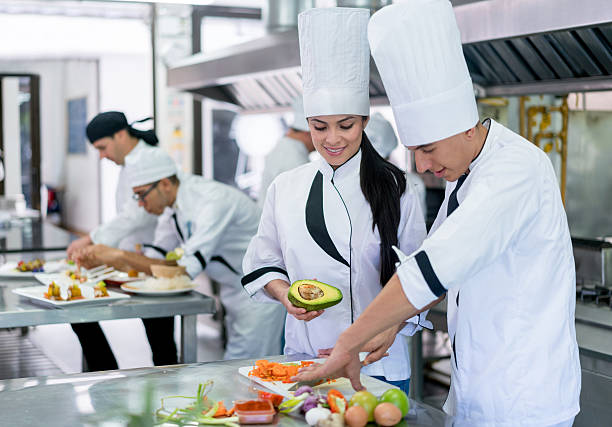 istock Group of chefs cooking 564594474