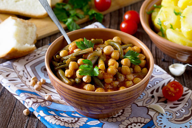 istock stewed chickpeas with tomatoes, garlic and green beans 564595930