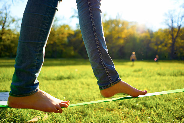 istock Woman walking on a slackline 564596356