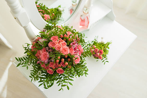 istock Pink bouquet of flowers on a white table 564596922