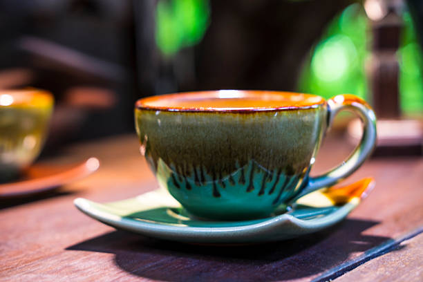 istock cup of coffee on wooden desk 564597348