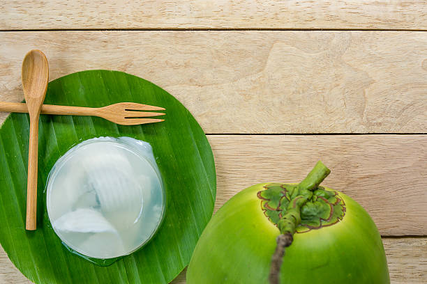 coconut jelly and wooden spoon on wooden background