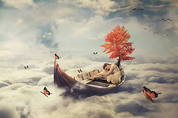 Young lonely beautiful woman drifting on a boat above clouds. Dreamy screensaver with skyline background