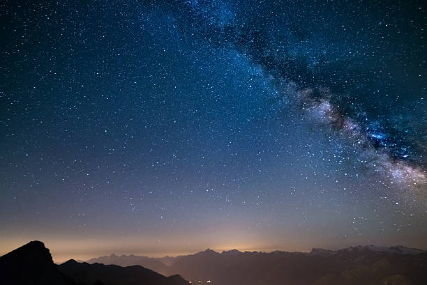 istock Glowing Milky Way and starry sky from the Alps 564602218