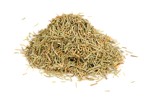 A pile of dried rosemary isolated on a white background
