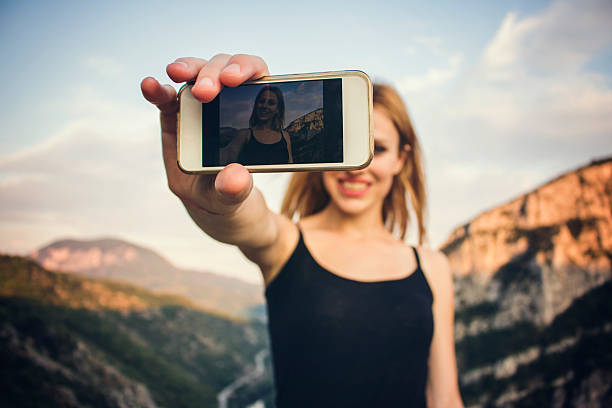 istock Beautiful girl taking a selfie 564606142