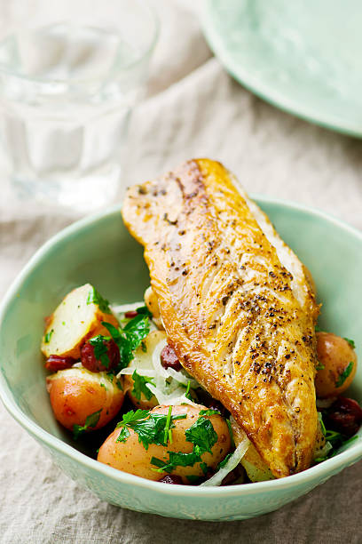 istock fried mackerel with potatoes in a bowl 564606798