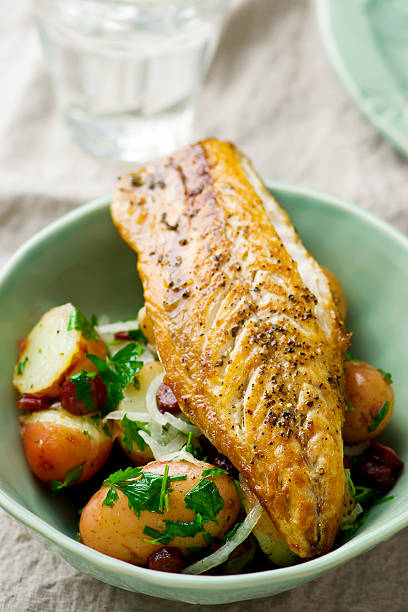 istock fried mackerel with potatoes in a bowl 564606810
