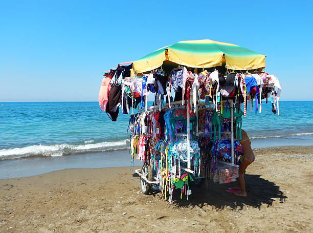 colorful swimsuit shop on wheels by  the beach