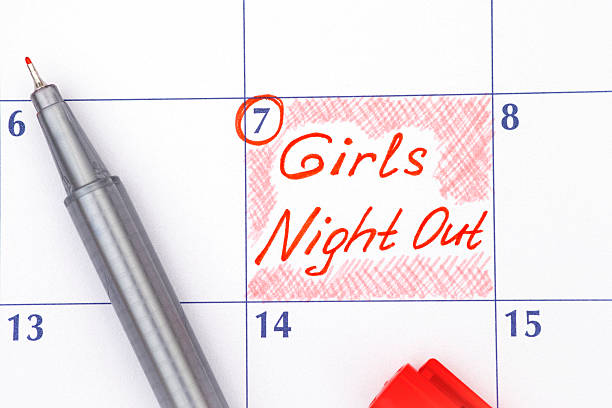 Reminder Girls Night Out in calendar with pen Reminder Girls Night Out in calendar with red pen ladies night stock pictures, royalty-free photos & images