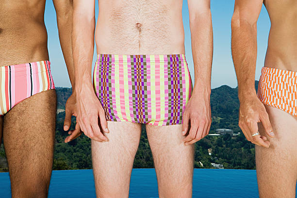 reihe von mann mit badehose - swim truncks stock-fotos und bilder