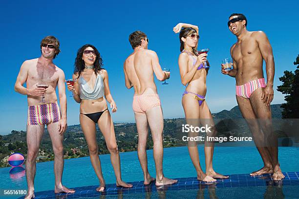 Friends Drinking Cocktails Poolside Stock Photo - Download Image Now - Cocktail, Men, Drinking