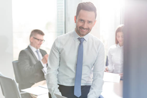 istock Portrait smiling businessman in conference room meeting 567166311