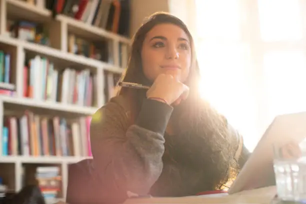 Photo of Pensive teenage girl with digital tablet