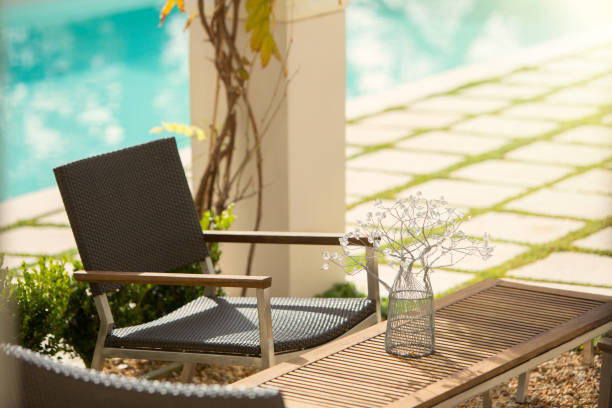istock Flower decoration on table at sunny poolside 568518449
