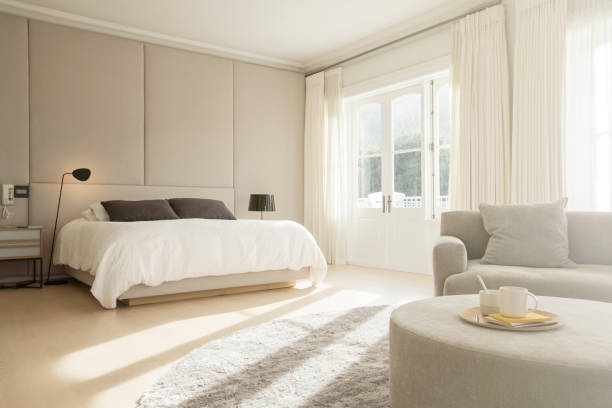 istock Sunny bedroom with sitting area 568518537