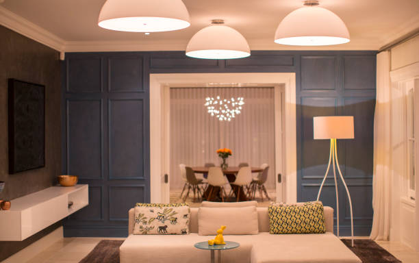 istock Illuminated domed lights over home showcase living room 568518613
