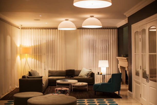 istock Illuminated domed lights over home showcase living room 568518619