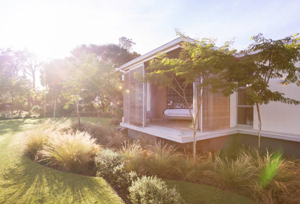 istock Sunny yard and modern house 568518625