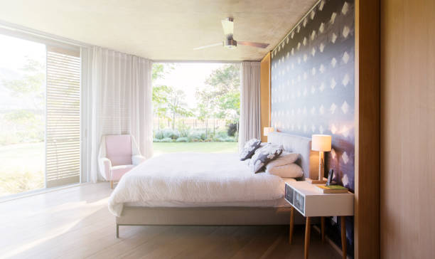 istock Luxury bedroom open to yard 568518671
