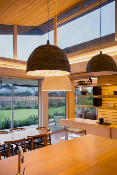 istock Illuminated modern pendants hanging over wood kitchen island 568518803