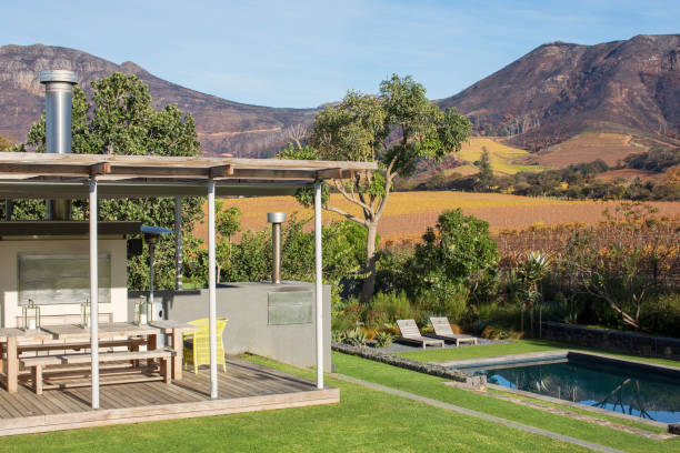 istock Mountains behind patio with swimming pool 568518869