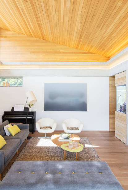 istock Slanted wood ceiling over living room 568518871