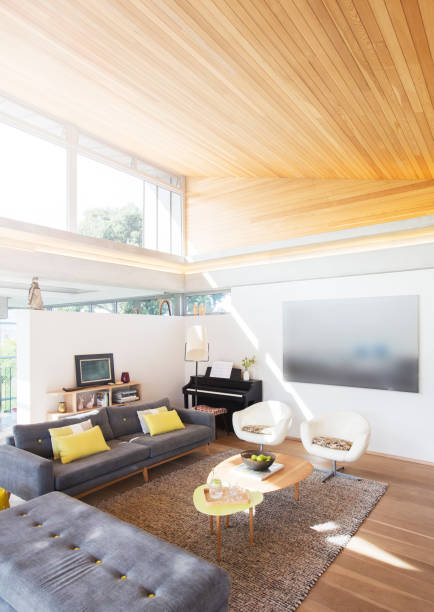 istock Slanted wood ceiling over living room 568518955