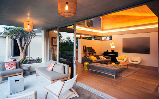 istock Illuminated living room open to patio 568518969