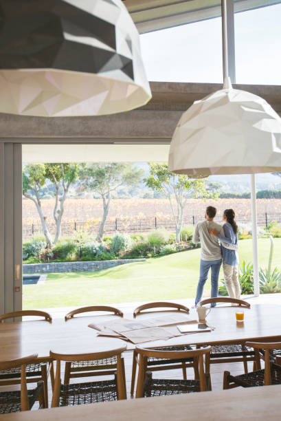 istock Couple hugging on luxury patio 568519119
