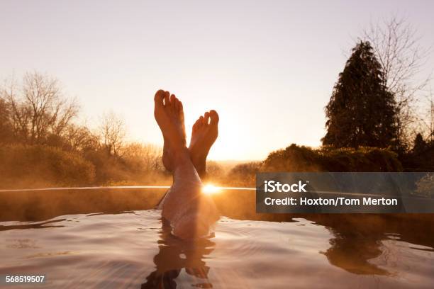 Mans Feet Raised Out Of Pool Stock Photo - Download Image Now - Hot Tub, Relaxation, Swimming Pool