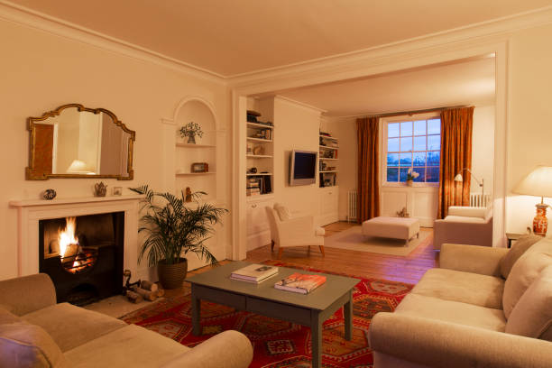 istock Illuminated living room with fireplace 568519533