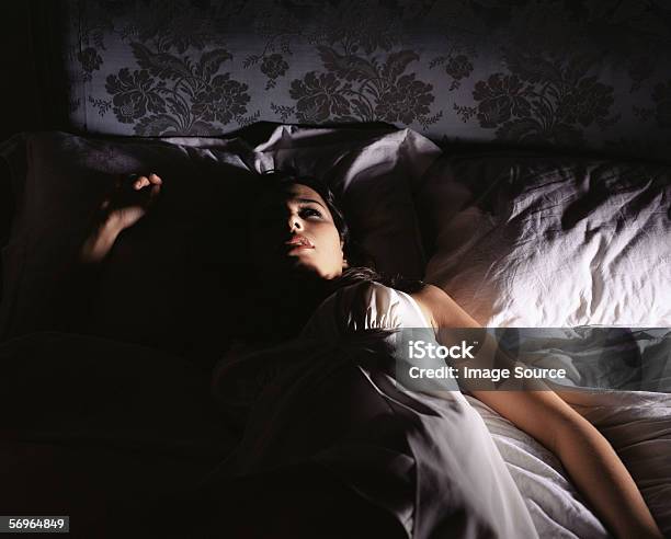 Woman Lying In Bed Stock Photo - Download Image Now - Insomnia, Women, One Woman Only