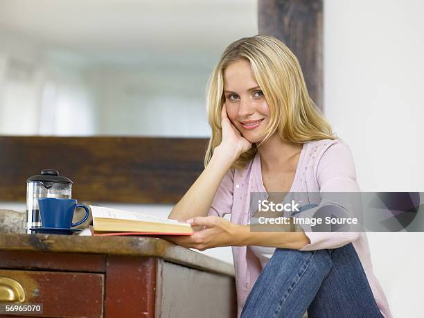 Woman Relaxing With A Book Stock Photo - Download Image Now - Adult, Adults Only, Blond Hair