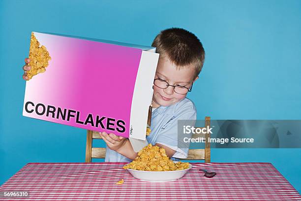 Boy Pouring Cornflakes Stock Photo - Download Image Now - Corn Flakes, Box - Container, Breakfast Cereal