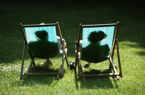 Couple reclining in deckchairs
