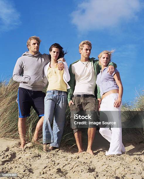 Group Of Friends On Beach Stock Photo - Download Image Now - Adult, Adults Only, American Beachgrass