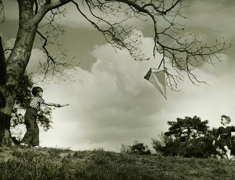 Little boy playing with kite