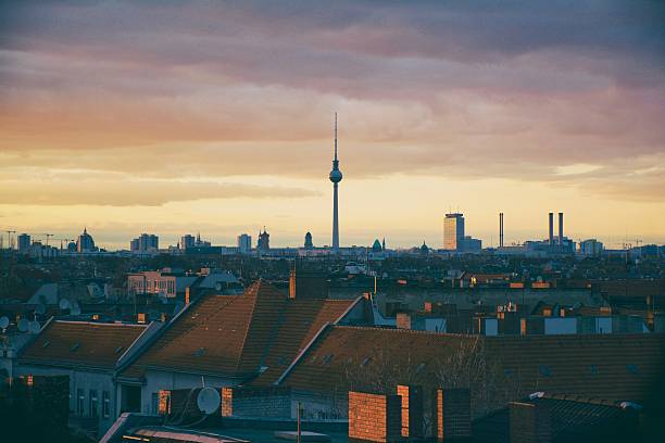 istock Cityscape By Fernsehturm Against Cloudy Sky At Sunset 573904981