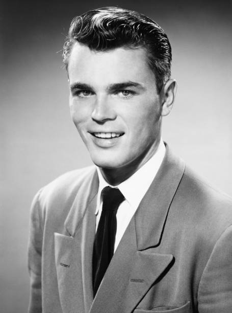 Young man posing in studio, (B&W), (Close-up), (Portrait)  slicked back hair stock pictures, royalty-free photos & images