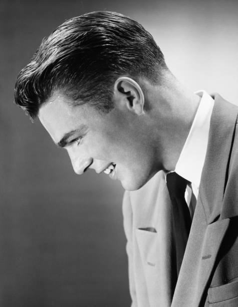 Young man posing in studio, (B&W), (Close-up), (Portrait)  slicked back hair stock pictures, royalty-free photos & images