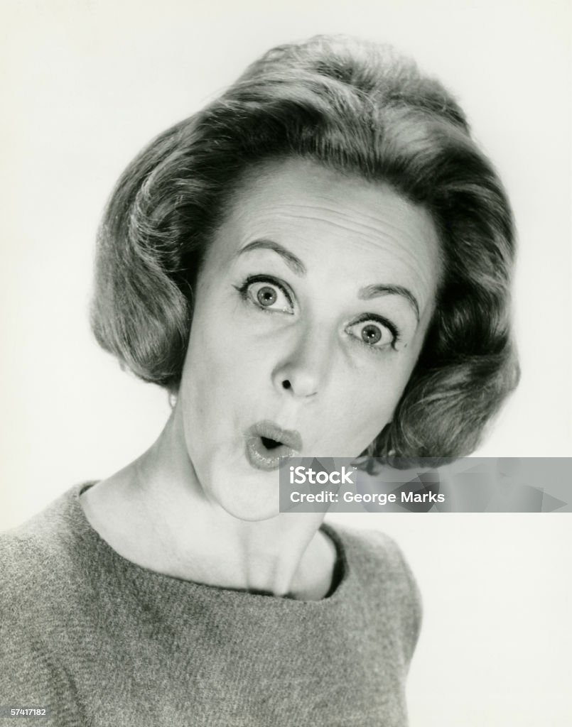 Mujer con sorprendida expresión, posando en studio. - Foto de stock de Anticuado libre de derechos