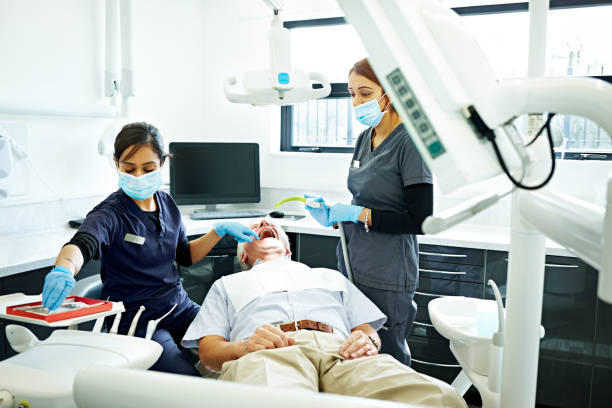 Patient getting a dental treatment at clinic