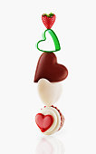 istock Heart-shaped desserts balancing 575131313